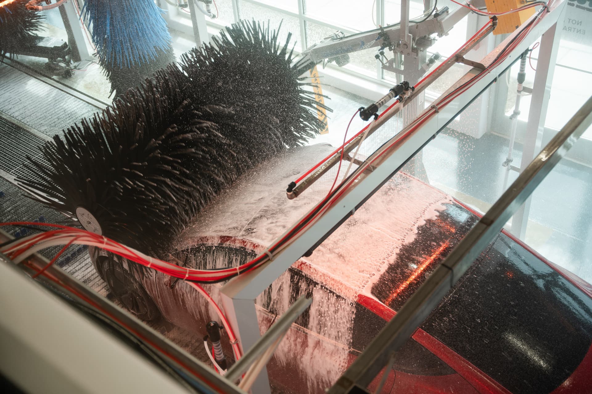 Wash arches applying soap and rinse along the length of the tunnel